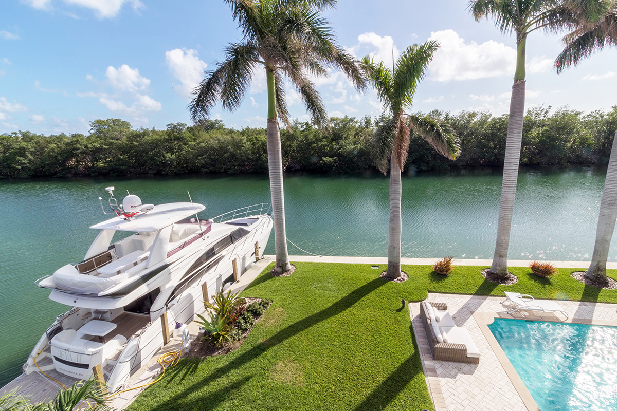  This one-of-a-kind home features a seawall on two sides. Two yachts can be moored on the side seawalls, allowing for uninterrupted views of Pines Canal from the pool and home. No neighbors in front allows for absolute privacy — priceless! 