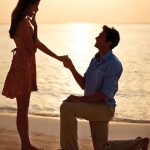 Main-Photo-on-RIGHT_10982116-young-man-proposing-marriage-to-surprised-woman-on-the-beach-at-sunset