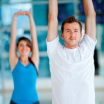 Movement-Guru_10957031-people-at-the-gym-stretching-their-arms