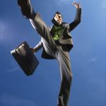 PAge-4_6455359-young-businessman-leaps-over-the-viewer-with-a-briefcase-in-hand-vertical-shot