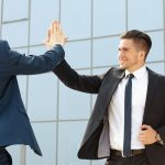 Two  business colleagues high-fiving