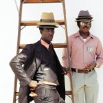 Workers from Jamaica wait at Miami’s airport for the airplane