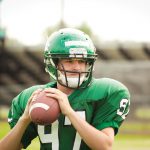 Amrtican Football Player Quarterback Throwing a Pass Close-up