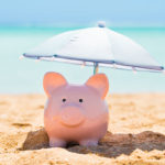 Piggy Bank Under The Parasol At Beach