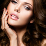 Close-up portrait of beautiful woman with bright make-up