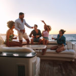 Group of friends enjoying in a boat party