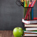School and office supplies and apple