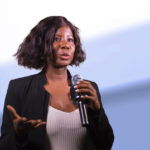 confident black African American business woman with microphone