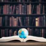 Heavy book and globe
