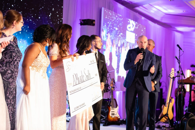 Pitbull inspires attendees as he announces the winner of the Dream Tank Competition.