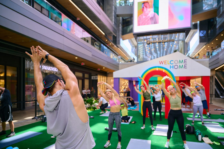 Participants stretch before a workout sponsored by Equinox aimed at helping create a sense of unity amongst all people.