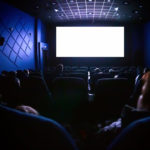 People in the cinema watching a movie.
