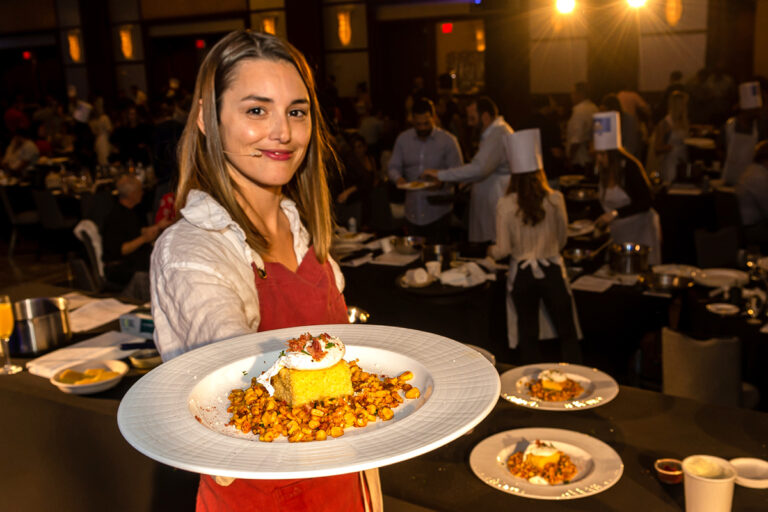 Chef Mika Leon holds up one of her culinary creations.