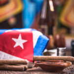 Items related to Cuba on wooden table