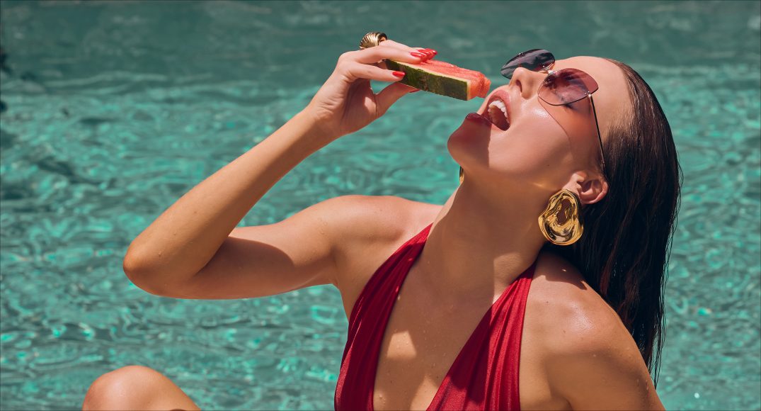 bm-october-2026-forever-summer Forever Summer fashion editorial: a red one-piece swimsuit by the pool in Miami